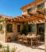 Maison en pierre avec pergola et terrasse dallée.
